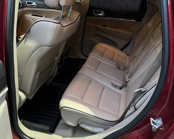 Красный Джип Гранд Чероки, объемом двигателя 5.65 л и пробегом 170 тыс. км за 20000 $, фото 4 на Automoto.ua