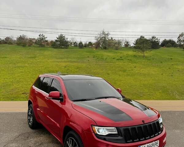 Красный Джип Гранд Чероки, объемом двигателя 6.4 л и пробегом 177 тыс. км за 31900 $, фото 1 на Automoto.ua