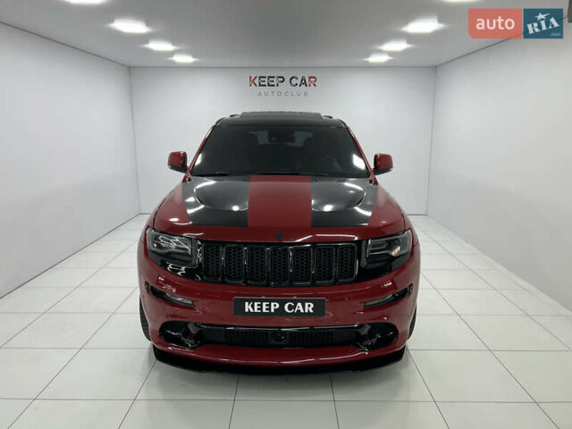 Красный Джип Гранд Чероки, объемом двигателя 6.42 л и пробегом 177 тыс. км за 33500 $, фото 1 на Automoto.ua