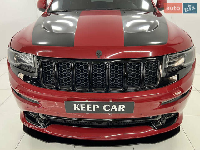 Красный Джип Гранд Чероки, объемом двигателя 6.42 л и пробегом 177 тыс. км за 33500 $, фото 9 на Automoto.ua