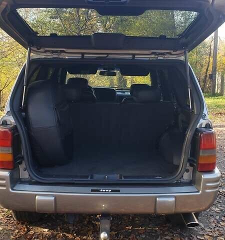 Сірий Джип Grand Cherokee, об'ємом двигуна 5.9 л та пробігом 216 тис. км за 10000 $, фото 6 на Automoto.ua