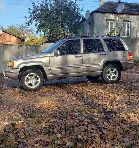 Сірий Джип Grand Cherokee, об'ємом двигуна 5.9 л та пробігом 216 тис. км за 10000 $, фото 4 на Automoto.ua