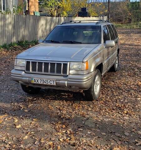 Сірий Джип Grand Cherokee, об'ємом двигуна 5.9 л та пробігом 216 тис. км за 10000 $, фото 5 на Automoto.ua