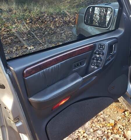 Сірий Джип Grand Cherokee, об'ємом двигуна 5.9 л та пробігом 216 тис. км за 10000 $, фото 17 на Automoto.ua