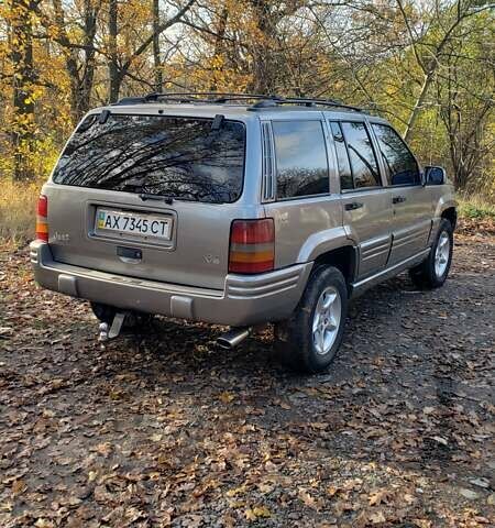 Сірий Джип Grand Cherokee, об'ємом двигуна 5.9 л та пробігом 216 тис. км за 10000 $, фото 2 на Automoto.ua