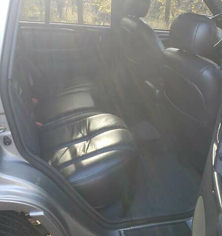 Сірий Джип Grand Cherokee, об'ємом двигуна 5.9 л та пробігом 216 тис. км за 10000 $, фото 12 на Automoto.ua