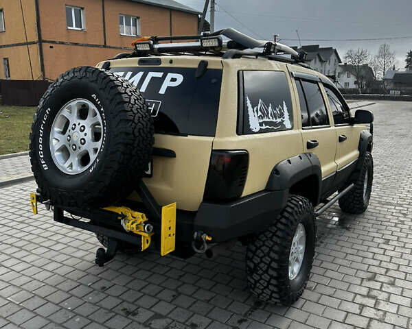 Сірий Джип Grand Cherokee, об'ємом двигуна 4 л та пробігом 230 тис. км за 12500 $, фото 5 на Automoto.ua