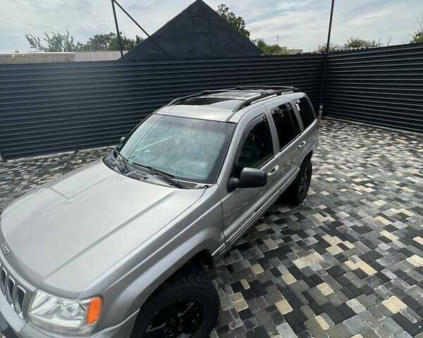 Сірий Джип Grand Cherokee, об'ємом двигуна 4.7 л та пробігом 165 тис. км за 6999 $, фото 1 на Automoto.ua