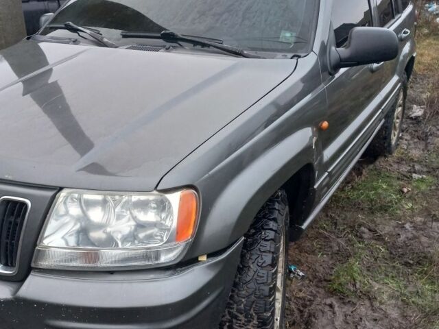 Серый Джип Гранд Чероки, объемом двигателя 2 л и пробегом 298 тыс. км за 5200 $, фото 5 на Automoto.ua