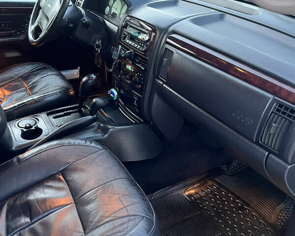 Сірий Джип Grand Cherokee, об'ємом двигуна 2.69 л та пробігом 250 тис. км за 9700 $, фото 13 на Automoto.ua