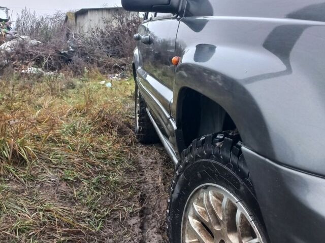 Серый Джип Гранд Чероки, объемом двигателя 2 л и пробегом 298 тыс. км за 5200 $, фото 1 на Automoto.ua