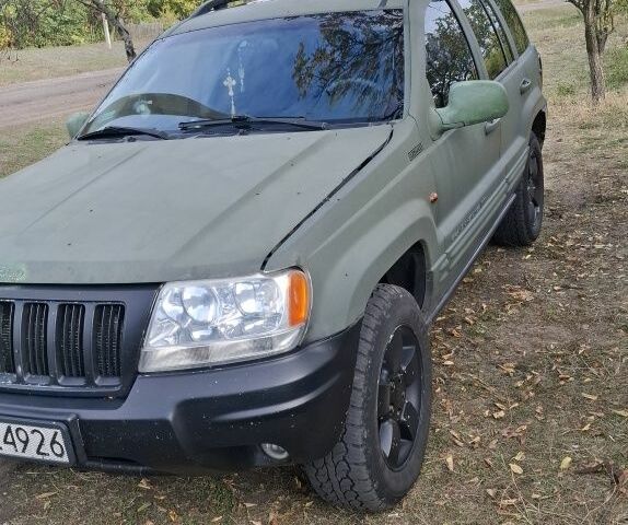 Джип Гранд Чероки 2003 в Новониколаевке на Automoto.ua Серый Джип Гранд Чероки, объемом двигателя 2.7 л и пробегом 348 тыс. км за 5200 $, фото 2 на Automoto.ua