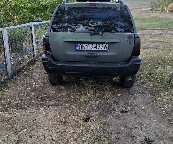 Джип Гранд Чероки 2003 в Новониколаевке на Automoto.ua Серый Джип Гранд Чероки, объемом двигателя 2.7 л и пробегом 348 тыс. км за 5200 $, фото 3 на Automoto.ua