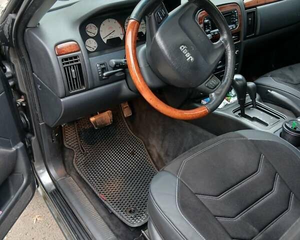 Серый Джип Гранд Чероки, объемом двигателя 2.69 л и пробегом 290 тыс. км за 7500 $, фото 2 на Automoto.ua