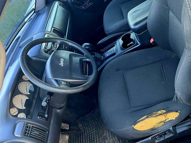 Сірий Джип Grand Cherokee, об'ємом двигуна 4 л та пробігом 274 тис. км за 2700 $, фото 4 на Automoto.ua
