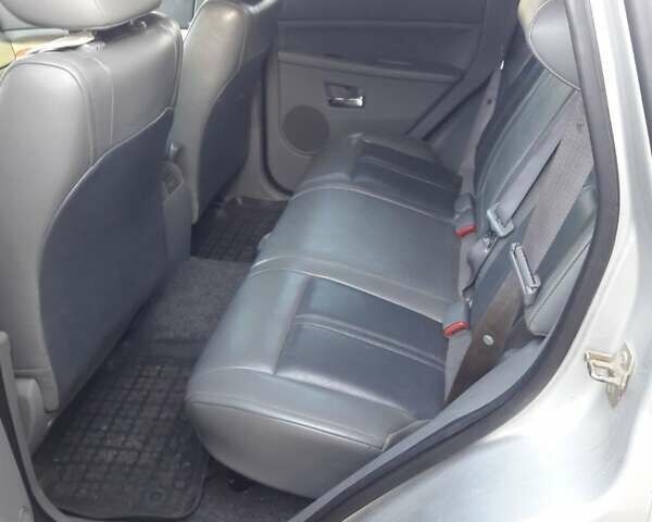 Серый Джип Гранд Чероки, объемом двигателя 5.65 л и пробегом 171 тыс. км за 10800 $, фото 5 на Automoto.ua