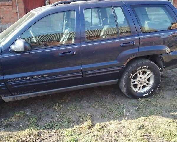 Синий Джип Гранд Чероки, объемом двигателя 4.7 л и пробегом 247 тыс. км за 7200 $, фото 2 на Automoto.ua