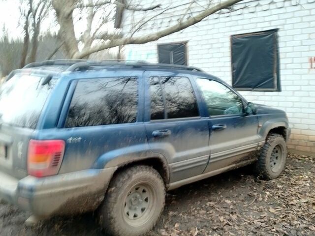 Синий Джип Гранд Чероки, объемом двигателя 3 л и пробегом 300 тыс. км за 4000 $, фото 3 на Automoto.ua