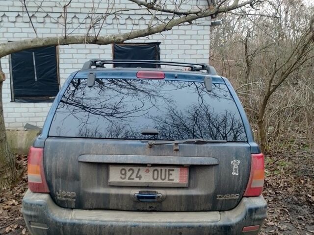 Синий Джип Гранд Чероки, объемом двигателя 3 л и пробегом 300 тыс. км за 4000 $, фото 4 на Automoto.ua