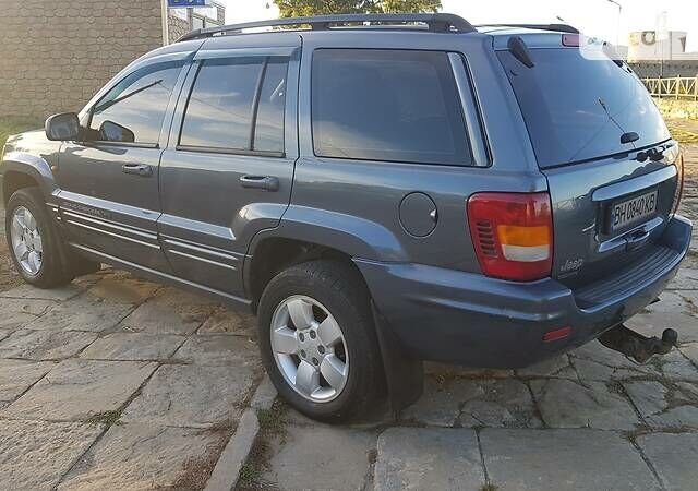 Синий Джип Гранд Чероки, объемом двигателя 2.7 л и пробегом 300 тыс. км за 10800 $, фото 3 на Automoto.ua