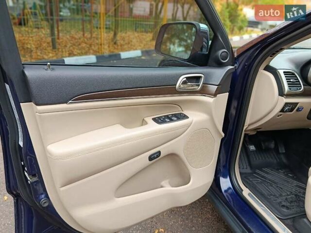 Синий Джип Гранд Чероки, объемом двигателя 5.65 л и пробегом 128 тыс. км за 27400 $, фото 1 на Automoto.ua