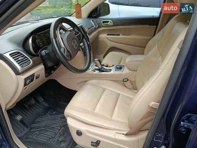 Синий Джип Гранд Чероки, объемом двигателя 5.65 л и пробегом 128 тыс. км за 27400 $, фото 3 на Automoto.ua