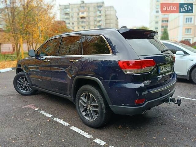 Синий Джип Гранд Чероки, объемом двигателя 5.65 л и пробегом 128 тыс. км за 27400 $, фото 5 на Automoto.ua