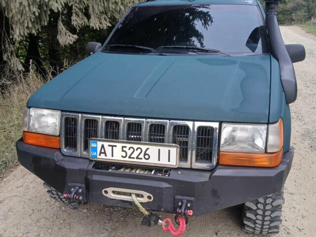 Зеленый Джип Гранд Чероки, объемом двигателя 2.5 л и пробегом 312 тыс. км за 9600 $, фото 6 на Automoto.ua