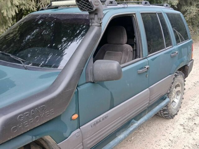 Зеленый Джип Гранд Чероки, объемом двигателя 2.5 л и пробегом 312 тыс. км за 9600 $, фото 4 на Automoto.ua
