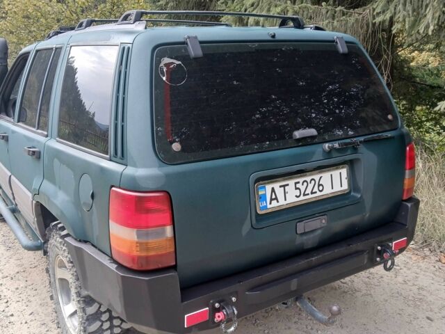 Зеленый Джип Гранд Чероки, объемом двигателя 2.5 л и пробегом 312 тыс. км за 9600 $, фото 3 на Automoto.ua