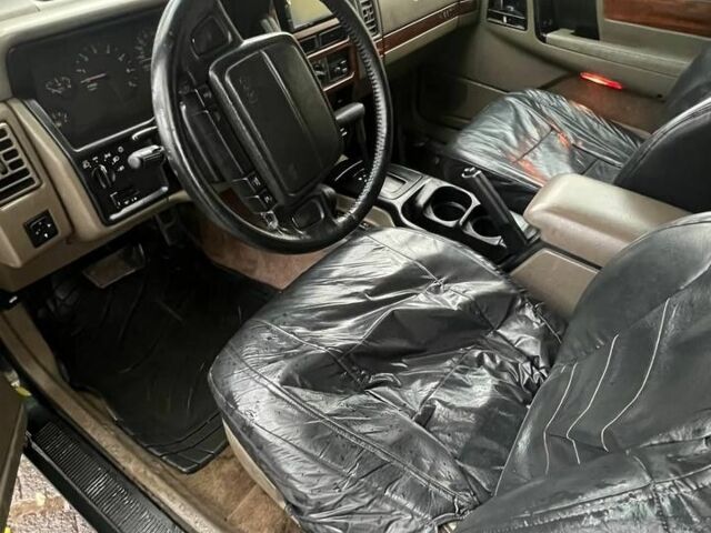 Зелений Джип Grand Cherokee, об'ємом двигуна 5.2 л та пробігом 200 тис. км за 3900 $, фото 5 на Automoto.ua