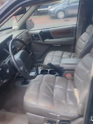 Зелений Джип Grand Cherokee, об'ємом двигуна 5.2 л та пробігом 421 тис. км за 3000 $, фото 5 на Automoto.ua