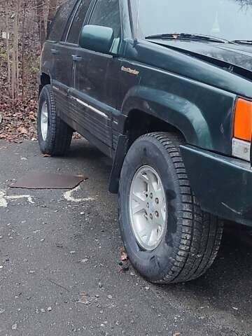 Зелений Джип Grand Cherokee, об'ємом двигуна 5.2 л та пробігом 421 тис. км за 3000 $, фото 2 на Automoto.ua