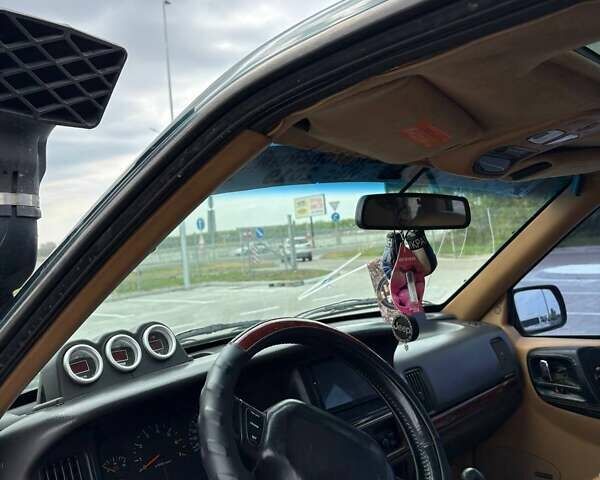 Зеленый Джип Гранд Чероки, объемом двигателя 3.96 л и пробегом 200 тыс. км за 4500 $, фото 3 на Automoto.ua