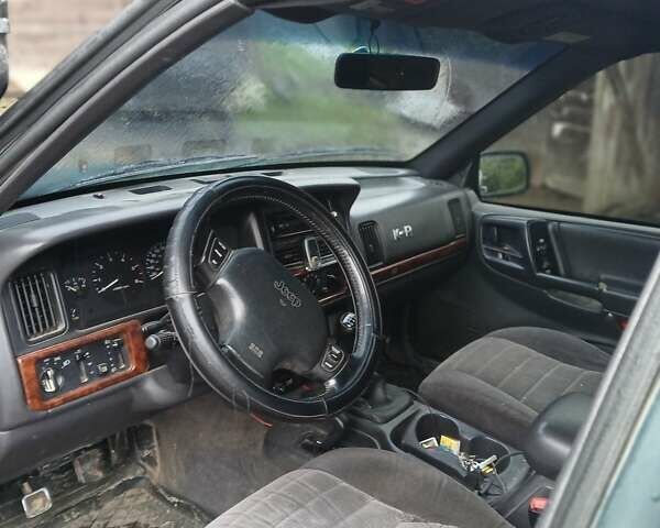 Зеленый Джип Гранд Чероки, объемом двигателя 2.5 л и пробегом 312 тыс. км за 9600 $, фото 2 на Automoto.ua