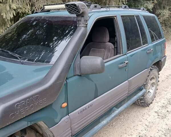 Зеленый Джип Гранд Чероки, объемом двигателя 2.5 л и пробегом 312 тыс. км за 9600 $, фото 5 на Automoto.ua