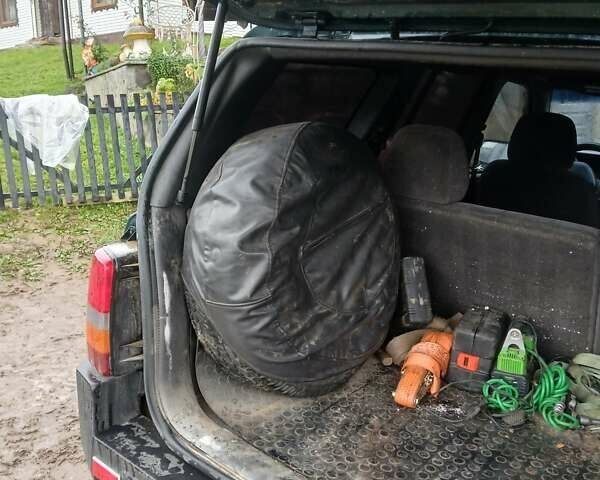 Зеленый Джип Гранд Чероки, объемом двигателя 2.5 л и пробегом 312 тыс. км за 9600 $, фото 3 на Automoto.ua