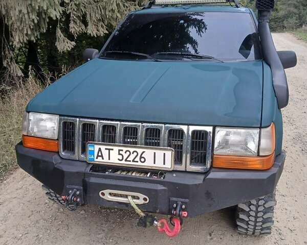 Зеленый Джип Гранд Чероки, объемом двигателя 2.5 л и пробегом 312 тыс. км за 9600 $, фото 6 на Automoto.ua