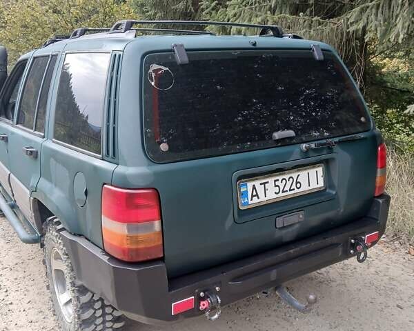 Зеленый Джип Гранд Чероки, объемом двигателя 2.5 л и пробегом 312 тыс. км за 9600 $, фото 4 на Automoto.ua