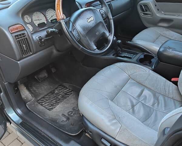 Зелений Джип Grand Cherokee, об'ємом двигуна 2.7 л та пробігом 374 тис. км за 9300 $, фото 19 на Automoto.ua