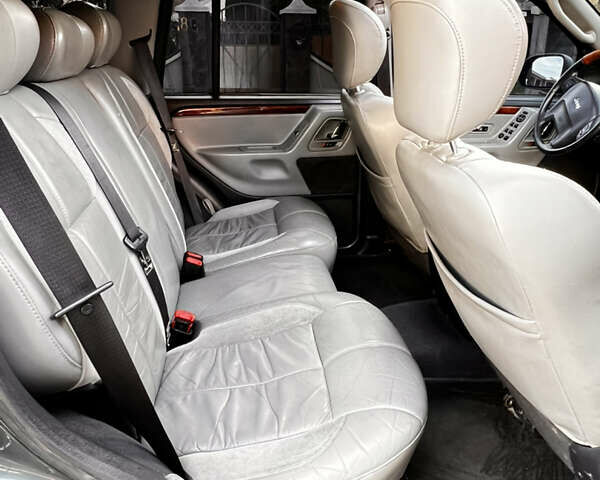 Зелений Джип Grand Cherokee, об'ємом двигуна 2.7 л та пробігом 376 тис. км за 9800 $, фото 23 на Automoto.ua