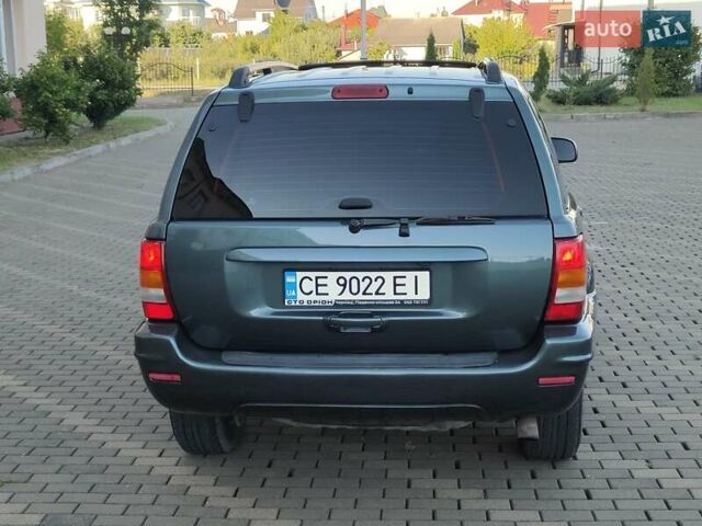 Зелений Джип Grand Cherokee, об'ємом двигуна 2.7 л та пробігом 374 тис. км за 9300 $, фото 3 на Automoto.ua