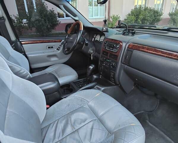 Зелений Джип Grand Cherokee, об'ємом двигуна 2.7 л та пробігом 374 тис. км за 9300 $, фото 26 на Automoto.ua