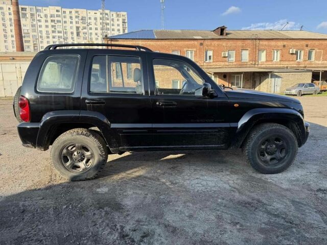 Черный Джип Либерти, объемом двигателя 2.5 л и пробегом 234 тыс. км за 2800 $, фото 1 на Automoto.ua