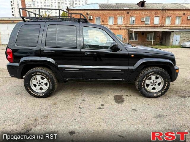 Черный Джип Либерти, объемом двигателя 2.5 л и пробегом 244 тыс. км за 3500 $, фото 4 на Automoto.ua