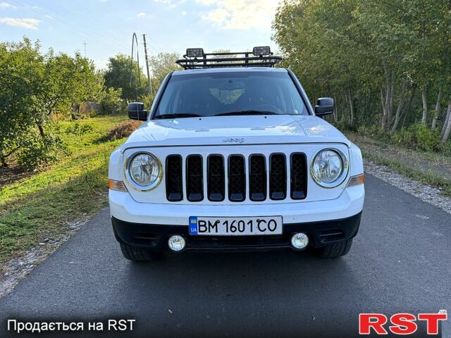 Білий Джип Patriot, об'ємом двигуна 2.4 л та пробігом 82 тис. км за 11200 $, фото 1 на Automoto.ua