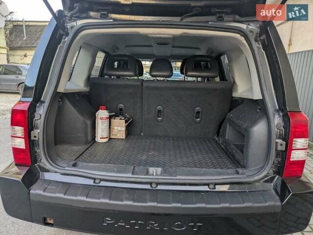 Чорний Джип Patriot, об'ємом двигуна 2.36 л та пробігом 267 тис. км за 7500 $, фото 7 на Automoto.ua