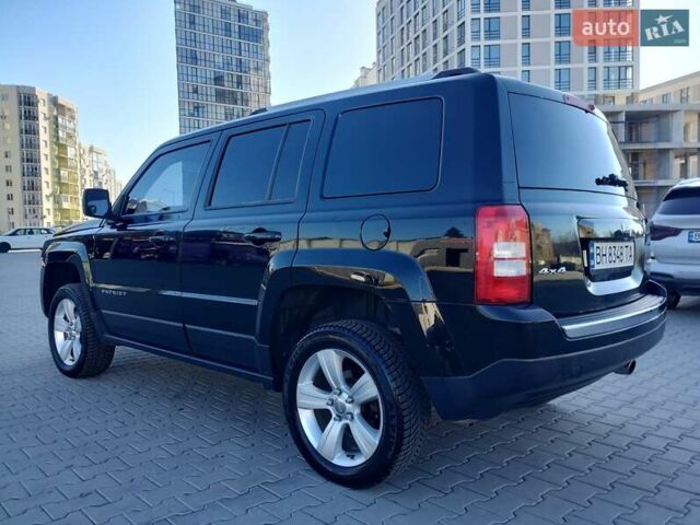 Черный Джип Патриот, объемом двигателя 2.36 л и пробегом 220 тыс. км за 12000 $, фото 1 на Automoto.ua