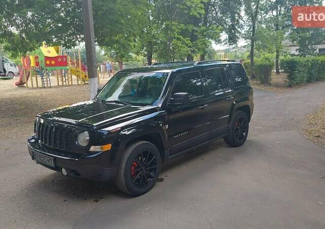 Черный Джип Патриот, объемом двигателя 2 л и пробегом 150 тыс. км за 9500 $, фото 1 на Automoto.ua