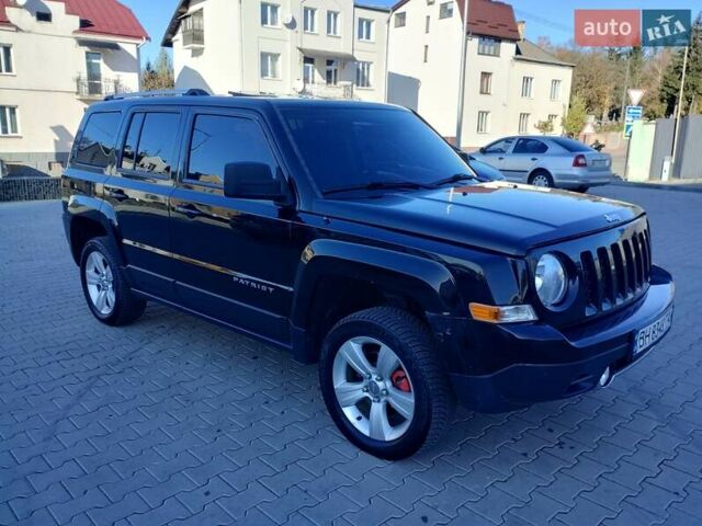 Черный Джип Патриот, объемом двигателя 2.36 л и пробегом 220 тыс. км за 12000 $, фото 2 на Automoto.ua